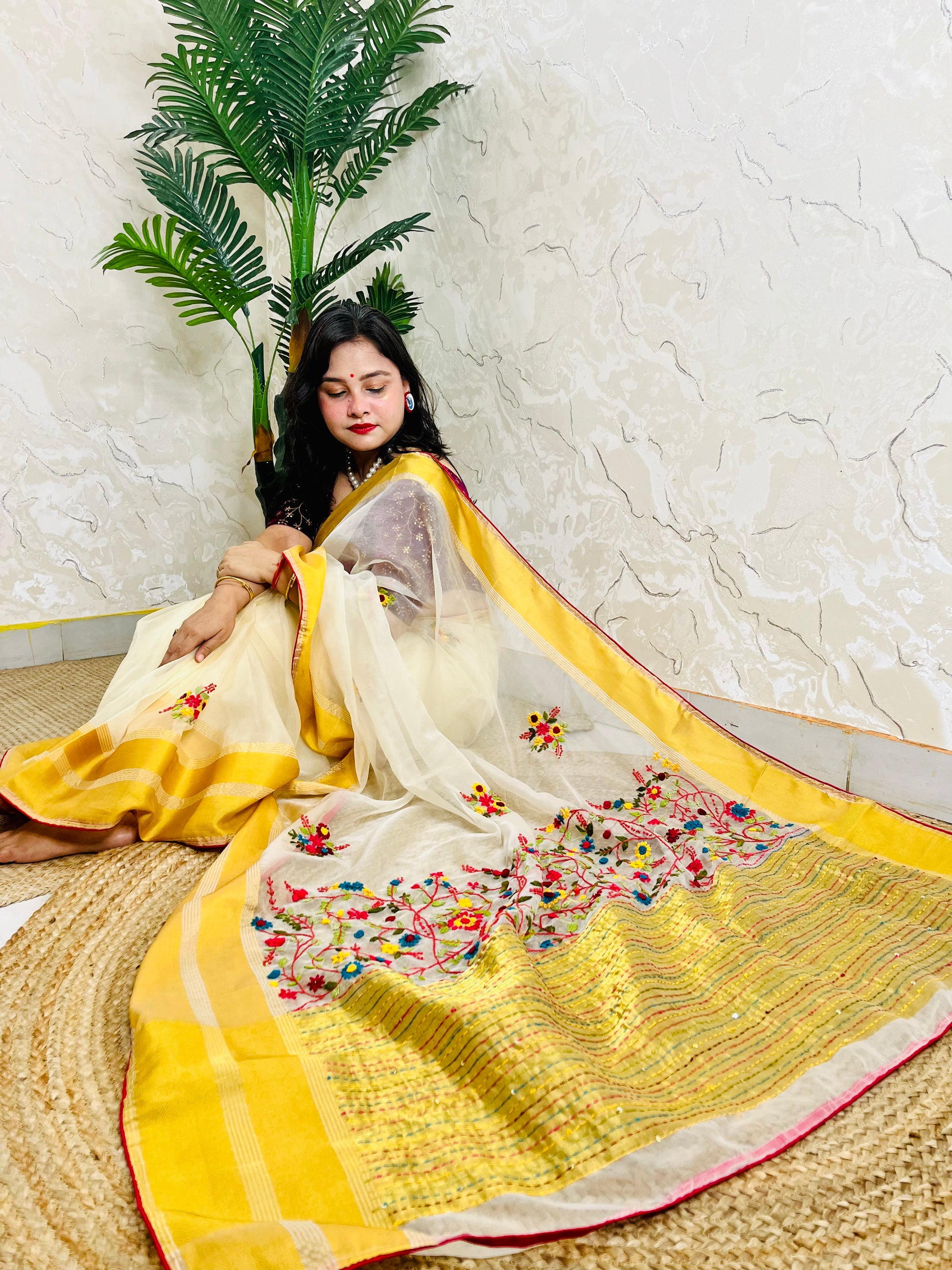 Limited edition off white Bullion Stitch French Knot organza silk saree draped on seated model — top sitting view, no blouse piece, Desi Aadat