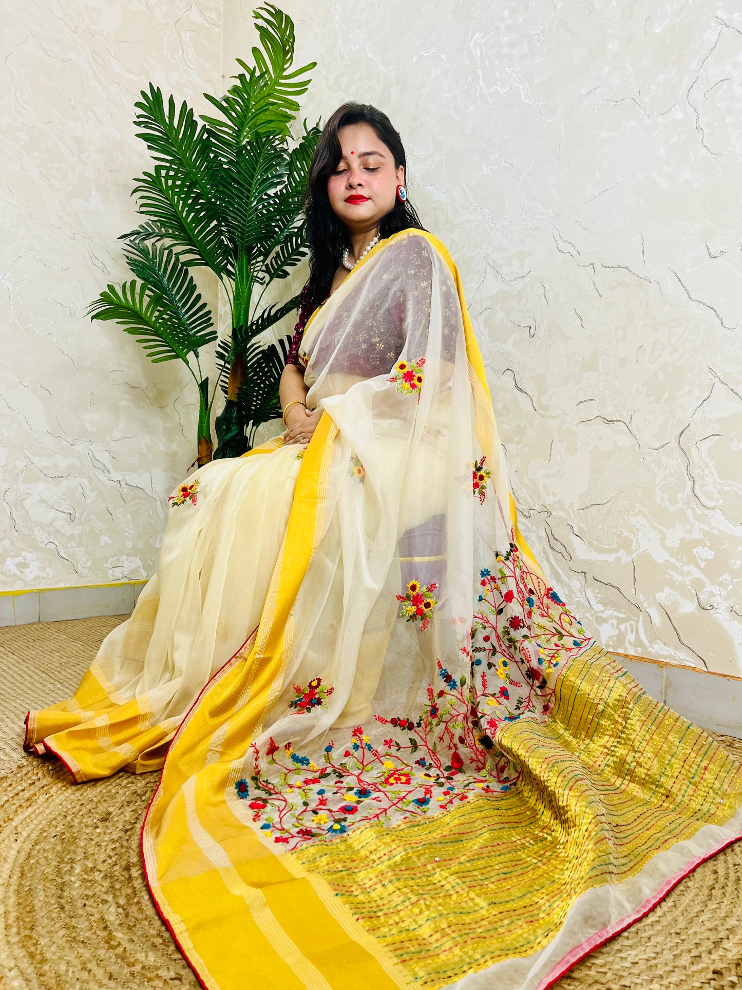 Limited edition off white Bullion Stitch French Knot organza silk saree draped on seated model — top sitting view, no blouse piece, Desi Aadat