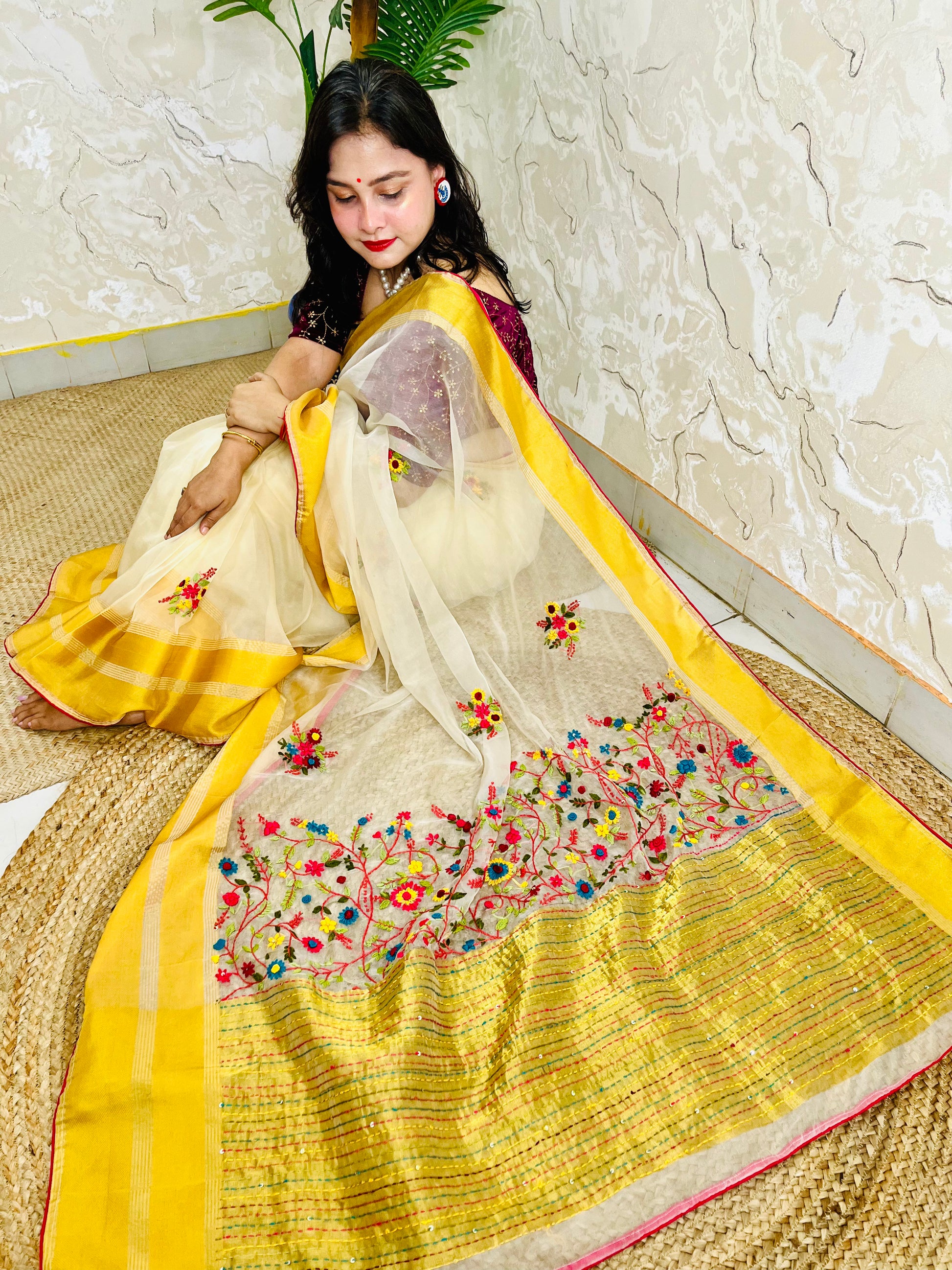 Limited edition off white Bullion Stitch French Knot organza silk saree draped on seated model — top sitting view, no blouse piece, Desi Aadat