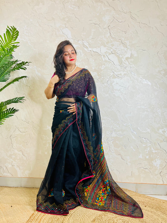 Beautiful woman in pure Black Organza Saree showcasing vibrant Bullion Stitch and French knot embroidered pallu — exclusive handcrafted ethnic wear by Desi Aadat