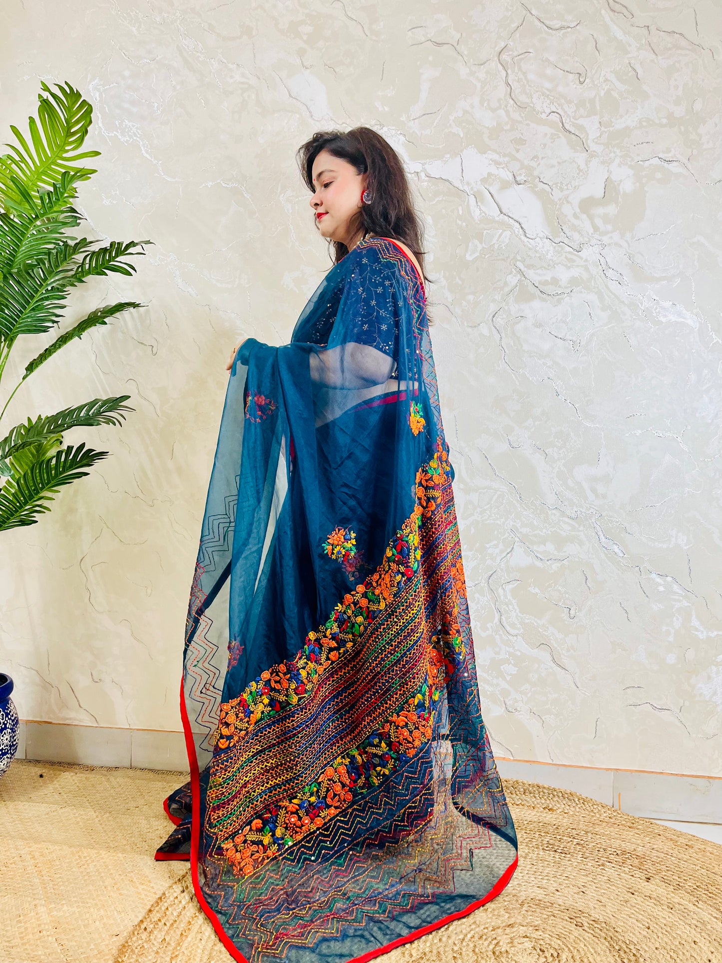 Full drape side view of Desi Aadat pure indigo organza silk saree adorned with handmade bullion stitch embroidery and French knot detailing — exclusive handcrafted Indian saree