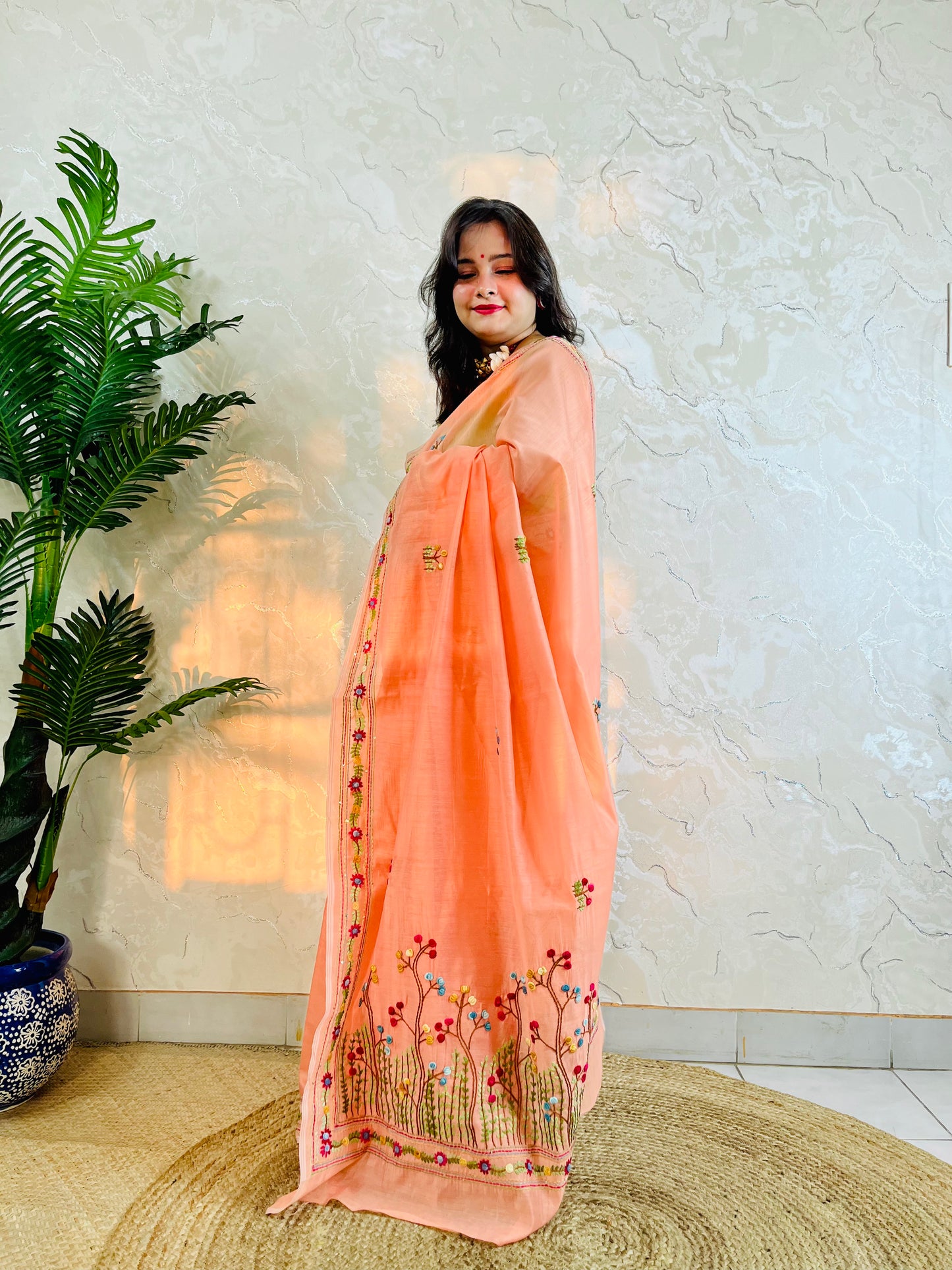 Pastel peach handwoven Chanderi silk cotton saree with hand-stitched floral embroidery, front drape view – Desi Aadat