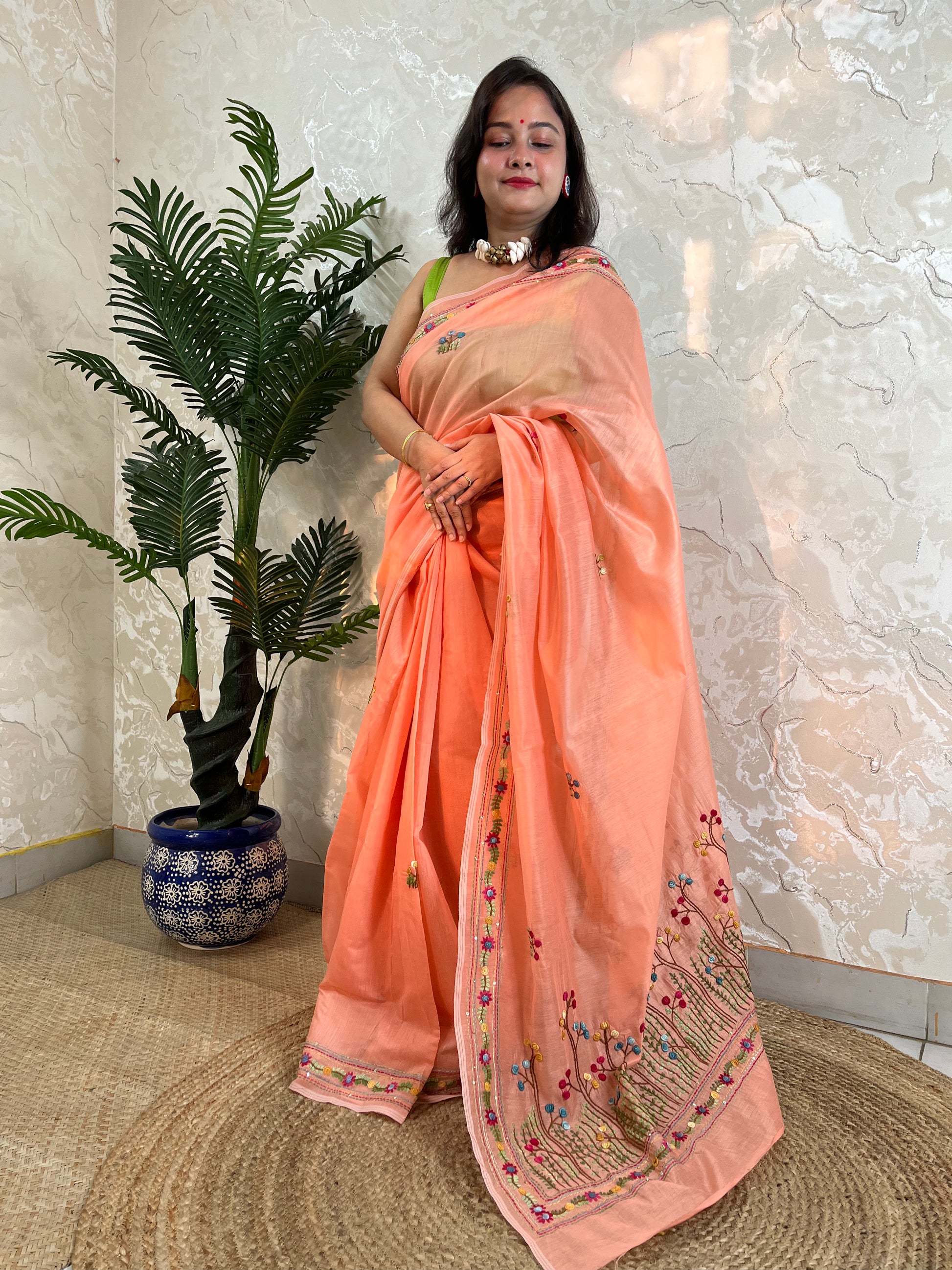 Pastel peach handwoven Chanderi silk cotton saree with hand-stitched floral embroidery, front drape view – Desi Aadat