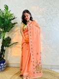 Pastel peach handwoven Chanderi silk cotton saree with hand-stitched floral embroidery, front drape view – Desi Aadat