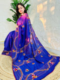 Woman draped in violet Chanderi silk cotton saree with raised bullion stitch embroidery, pallu flowing back view