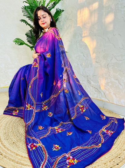 Woman draped in violet Chanderi silk cotton saree with raised bullion stitch embroidery, pallu flowing back view