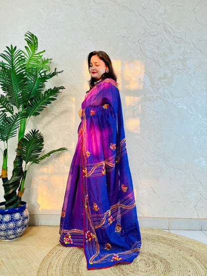 Side standing view of handwoven violet Chanderi silk cotton saree with bullion stitch and French knot floral work