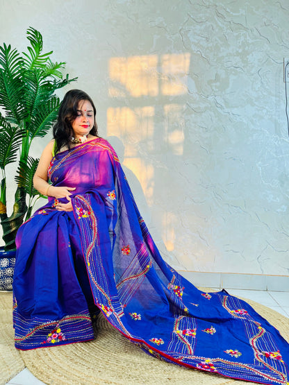 Woman draped in violet Chanderi silk cotton saree with raised bullion stitch embroidery, pallu flowing back view