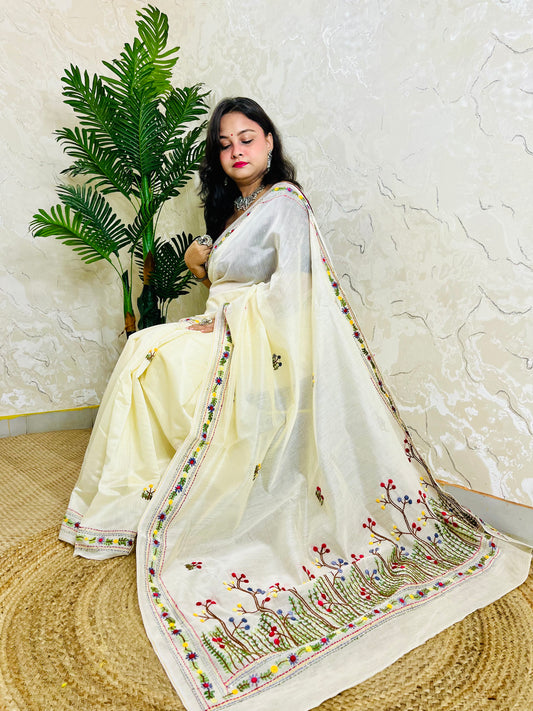 Handcrafted cream Chanderi silk cotton saree with multicolour French Knot and Bullion Stitch forest embroidery — sitting indoor view, Desi Aadat