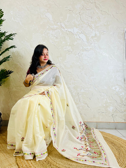 Handcrafted cream Chanderi silk cotton saree with multicolour French Knot and Bullion Stitch forest embroidery — sitting indoor view, Desi Aadat