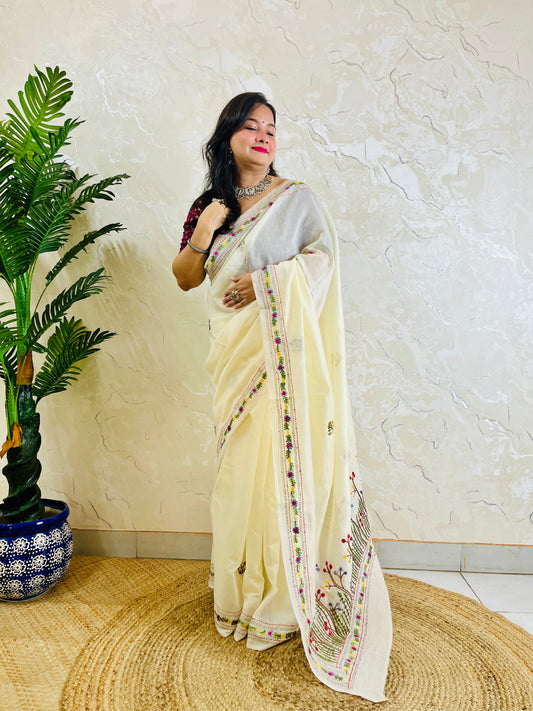 Handcrafted cream Chanderi silk cotton saree with multicolour French Knot and Bullion Stitch forest embroidery — standing indoor view, Desi Aadat