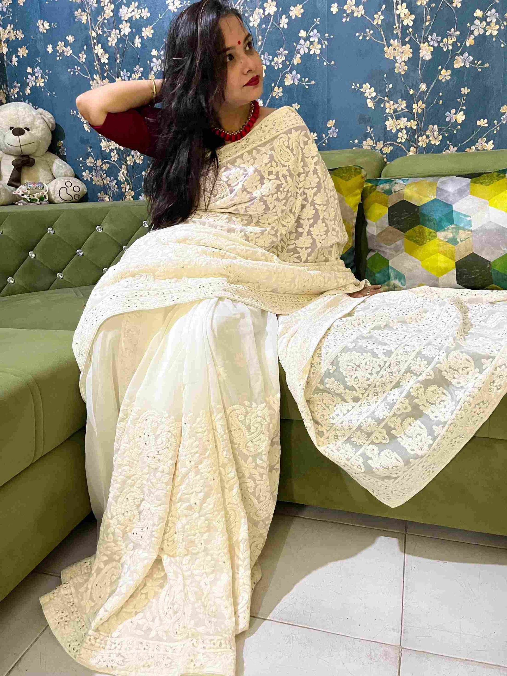 Close-up of Chikankari embroidery on Off-White georgette saree fabric