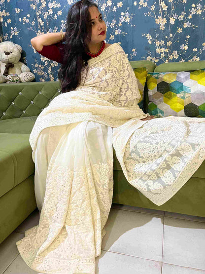 Close-up of Chikankari embroidery on Off-White georgette saree fabric