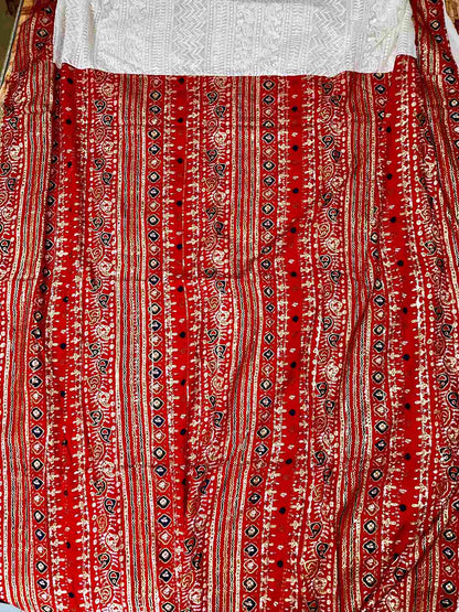 Close-up of Patola and Chikankari embroidery on georgette saree fabric