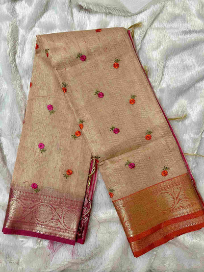 Graceful woman in Pink tissue saree showcasing Desi Aadat’s handwoven design