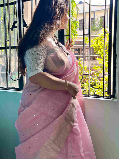 Close-up of mirror work on saree on Baby Pink kota saree cotton fabric
