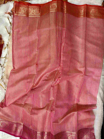 Graceful woman in Pink tissue saree showcasing Desi Aadat’s handwoven design