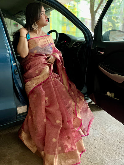 Close-up of crushed silk tissue fabric on Peach banarasi tissue saree