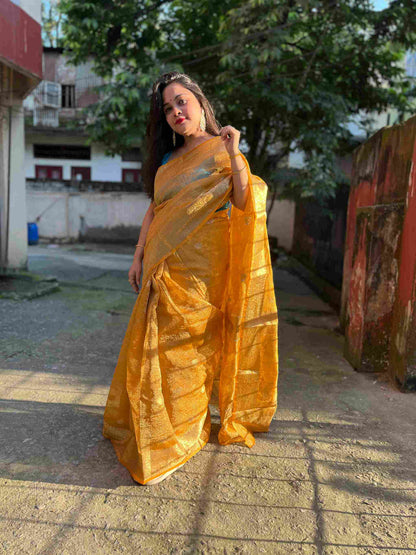 Close-up of crushed silk tissue fabric on Peach banarasi tissue saree