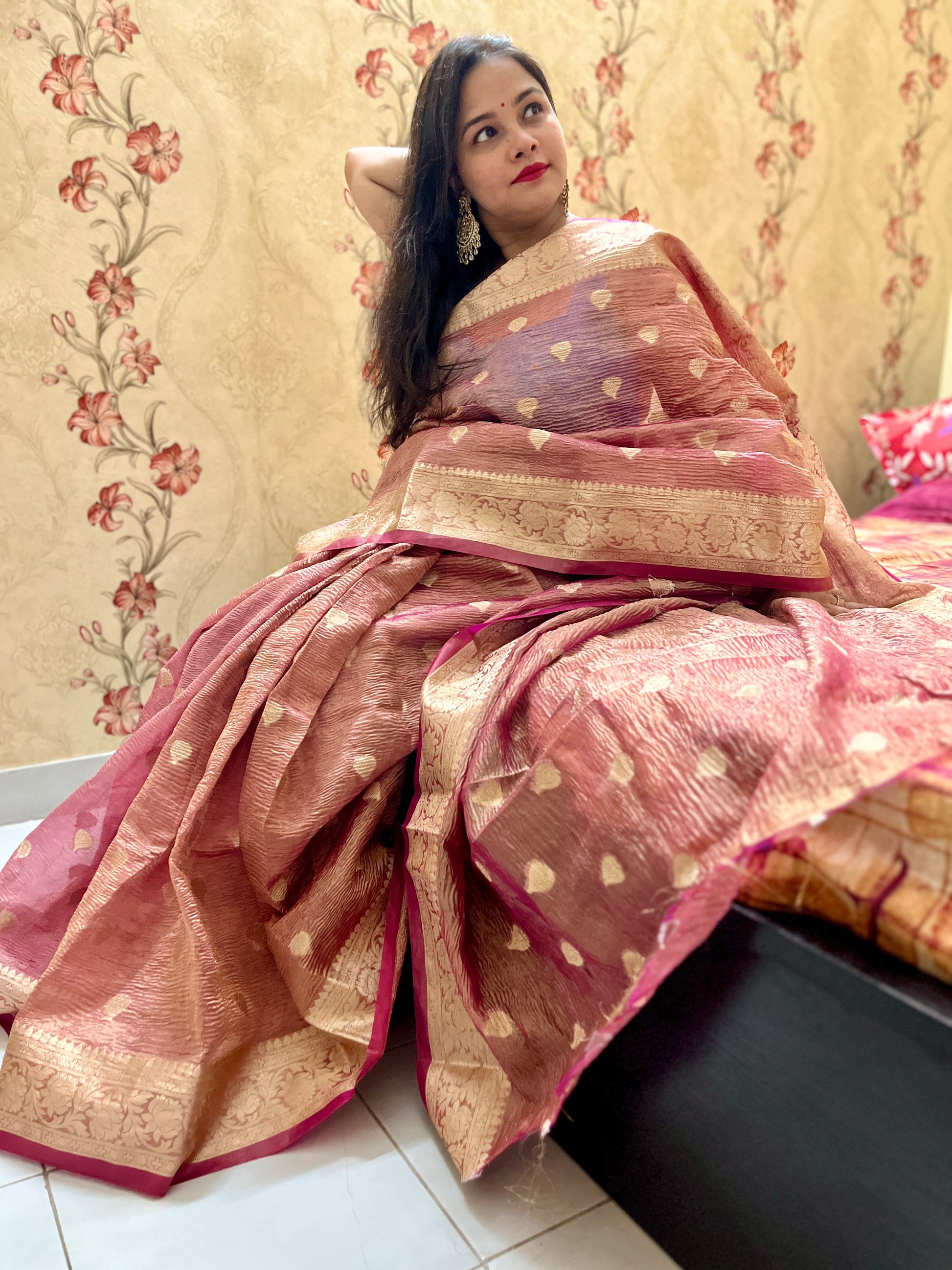 Close-up of crushed silk tissue fabric on Peach banarasi tissue saree