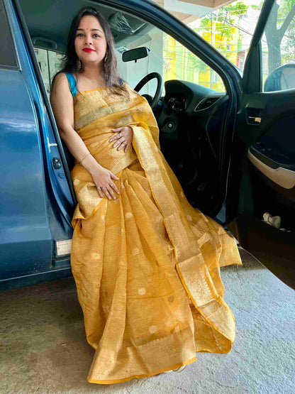 Close-up of crushed silk tissue fabric on Peach banarasi tissue saree