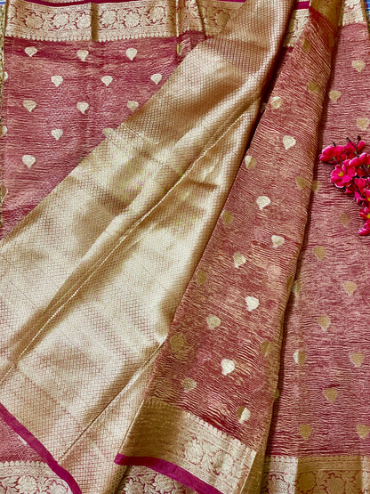 Elegant woman in Peach crush tissue saree showcasing Desi Aadat’s handwoven design