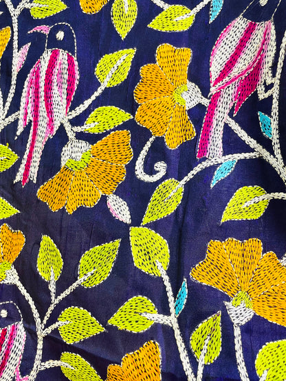 Close-up of hand-stitched Kantha bird and floral embroidery on navy blue Bangalore silk