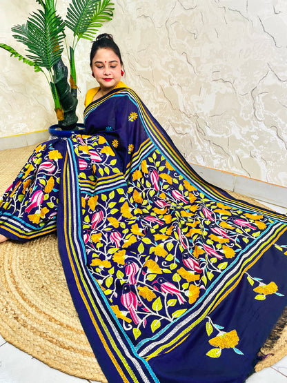 Woman draping navy blue Kantha stitch Bangalore silk saree with bird motif border