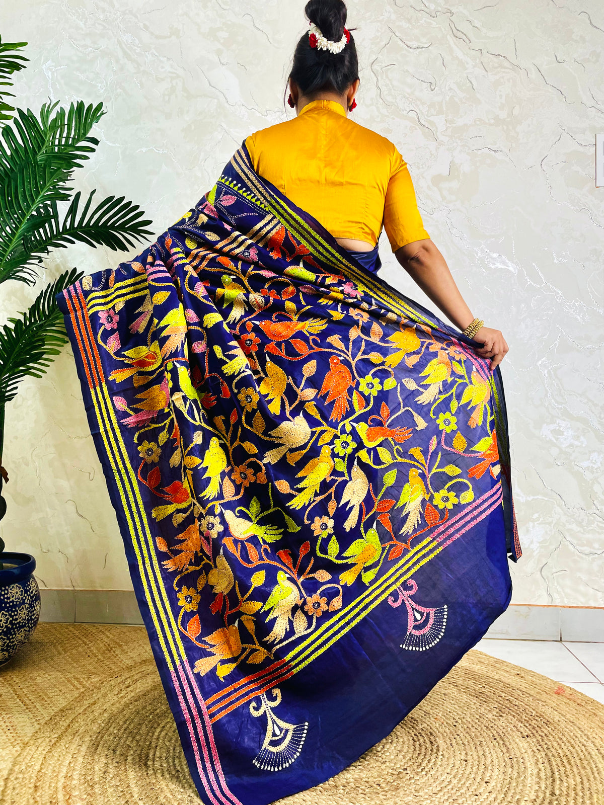 Back standing view of royal blue Bangalore silk saree with full Kantha bird embroidery