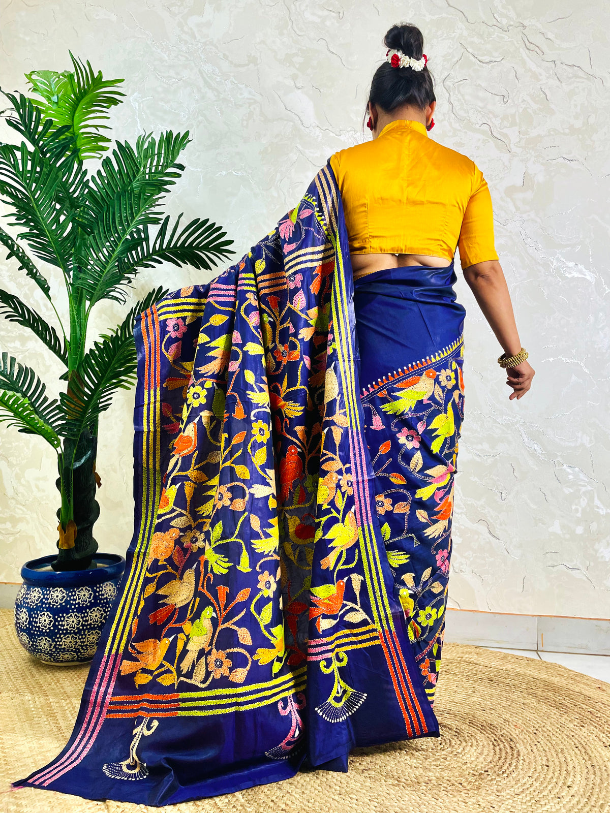 Back standing view of royal blue Bangalore silk saree with full Kantha bird embroidery