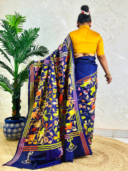 Back standing view of royal blue Bangalore silk saree with full Kantha bird embroidery