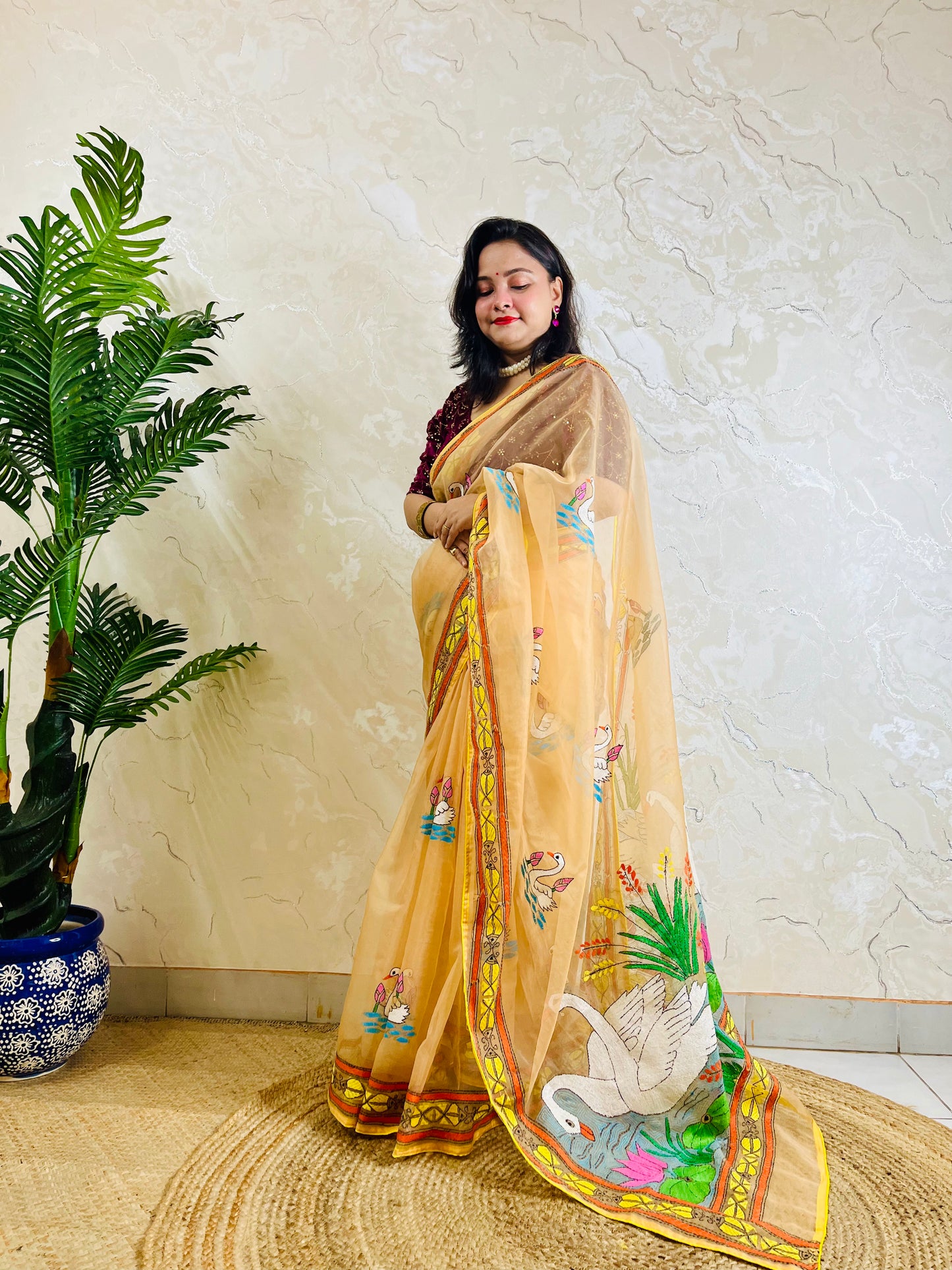 Beige-gold Kantha stitch organza saree with swan and lotus motif, front standing drape view