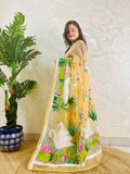 Beige gold organza saree with hansa swan and lotus motif, front standing view
