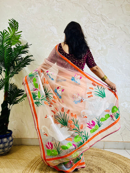 Peach-pink Kantha stitch organza saree with hand-embroidered swan and lotus motif, back standing pallu view