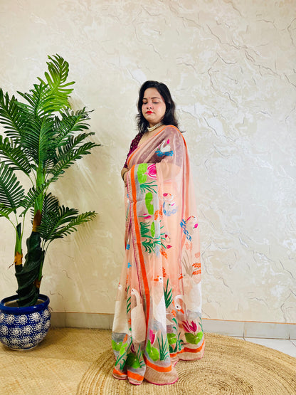 Peach-pink Kantha stitch organza saree with hand-embroidered swan and lotus motif, back standing pallu view