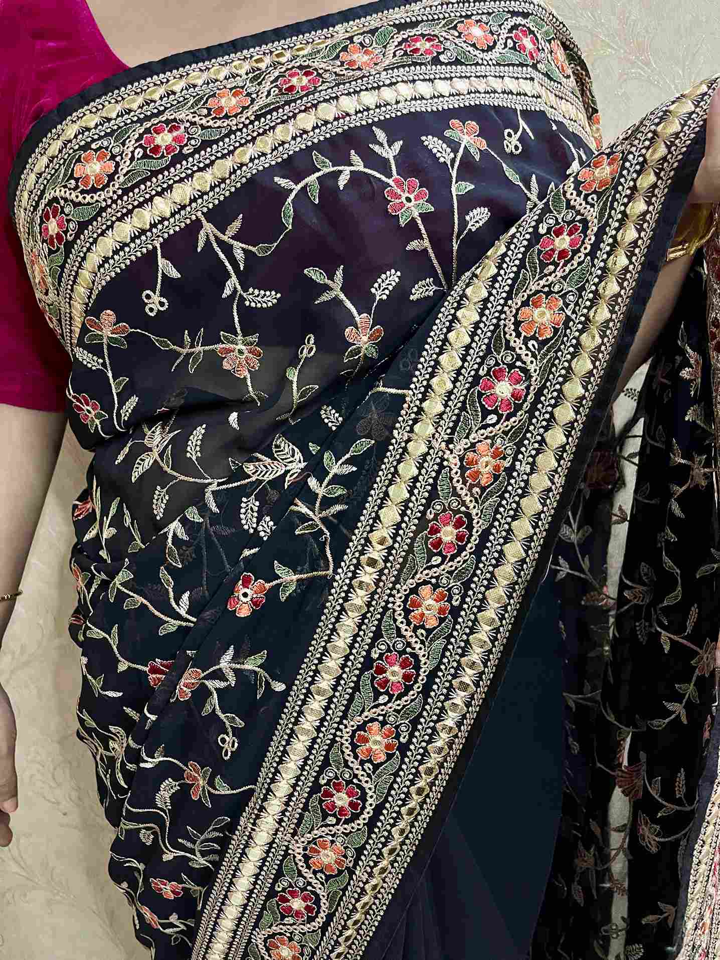 Elegant woman in Black georgette saree showcasing Desi Aadat’s party wear design