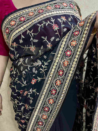 Elegant woman in Black georgette saree showcasing Desi Aadat’s party wear design