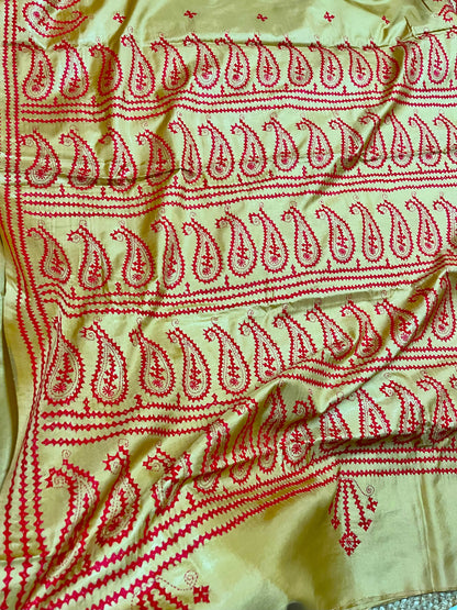 Close-up of paisley motif Kantha embroidery on golden yellow handwoven Blended Bangalore Silk fabric