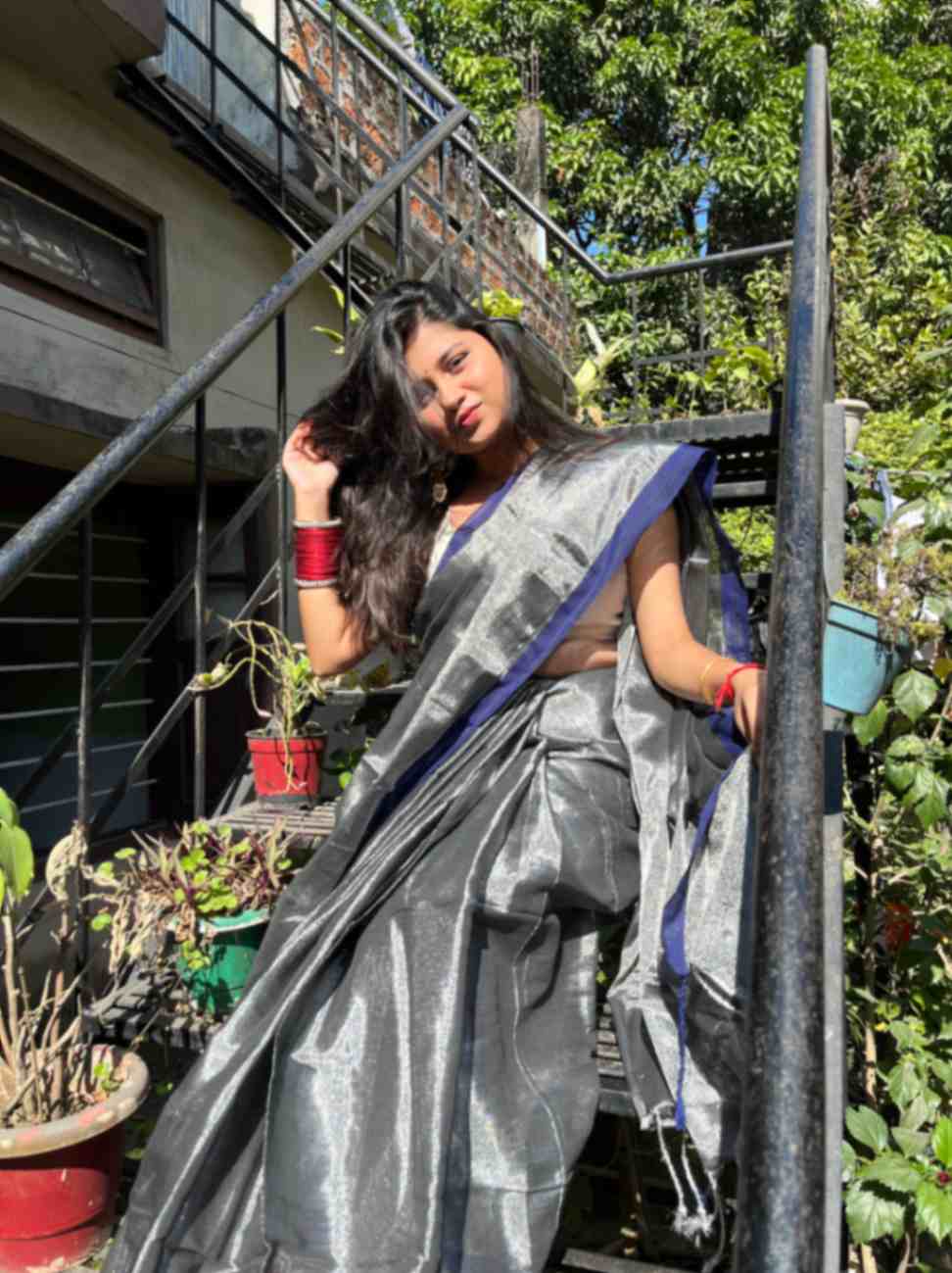 Experience the timeless beauty of a handwoven grey silver linen saree adorned with delicate blue zari, exclusively from Desi Aadat.