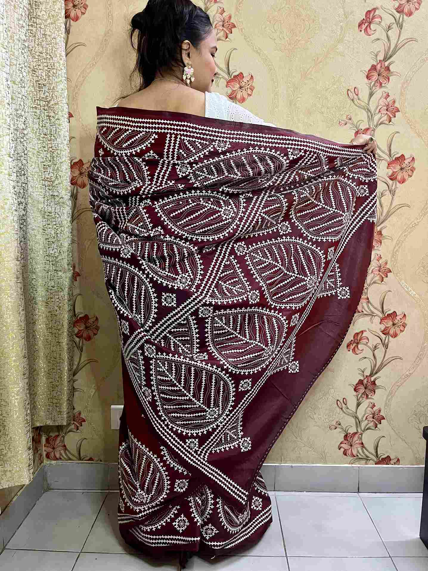 Detailed view of Kutch work saree embroidery on Maroon Brown silk fabric
