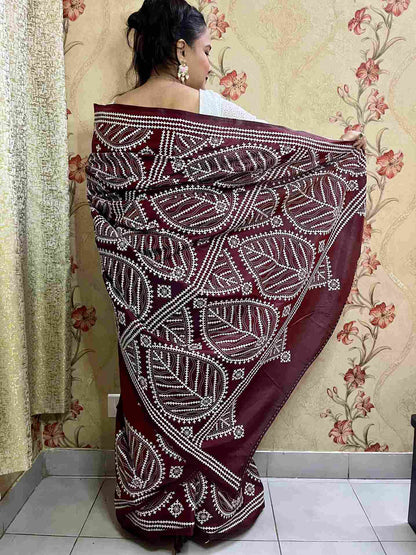 Detailed view of Kutch work saree embroidery on Maroon Brown silk fabric