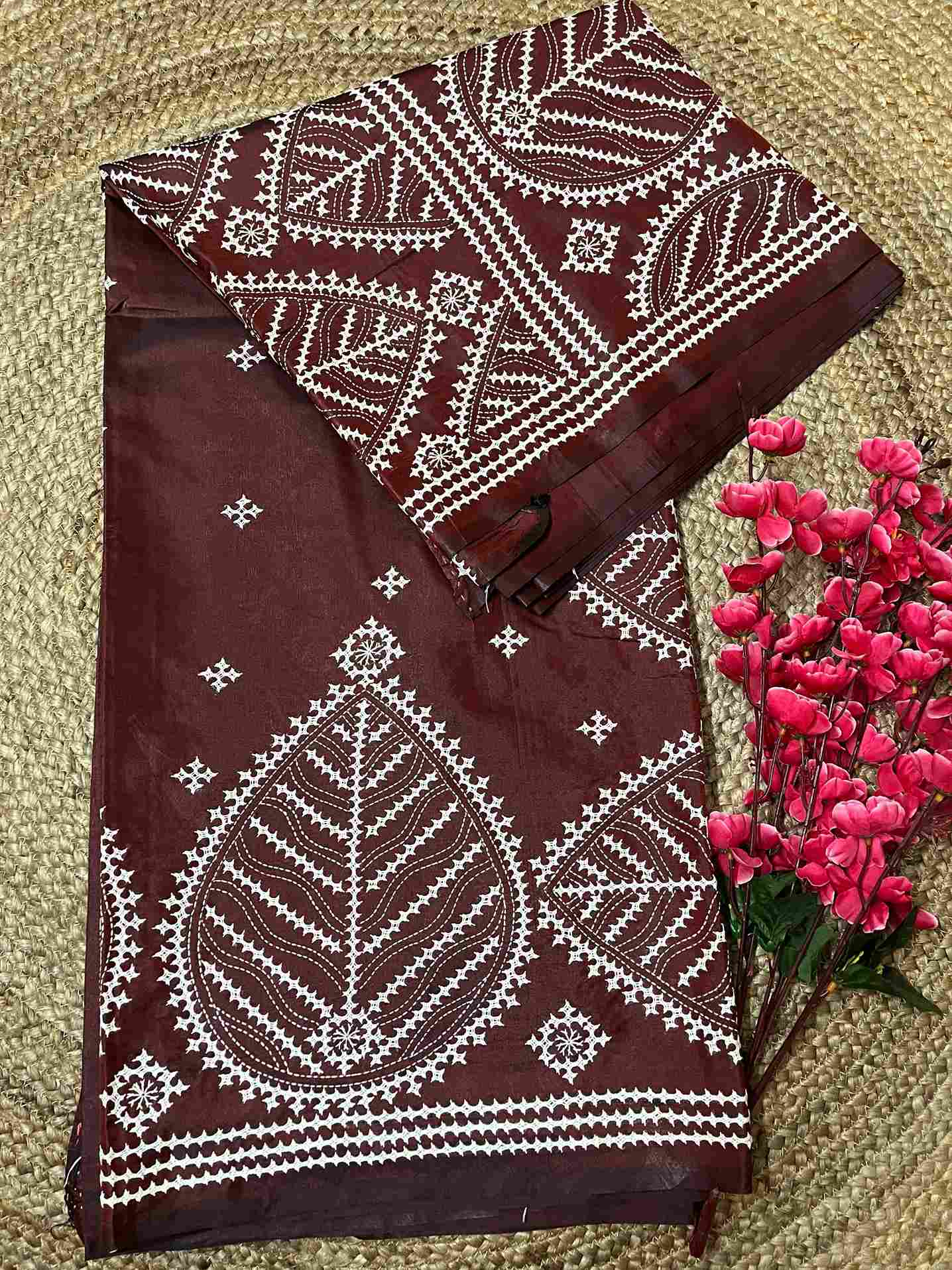 Detailed view of Kutch work saree embroidery on Maroon Brown silk fabric