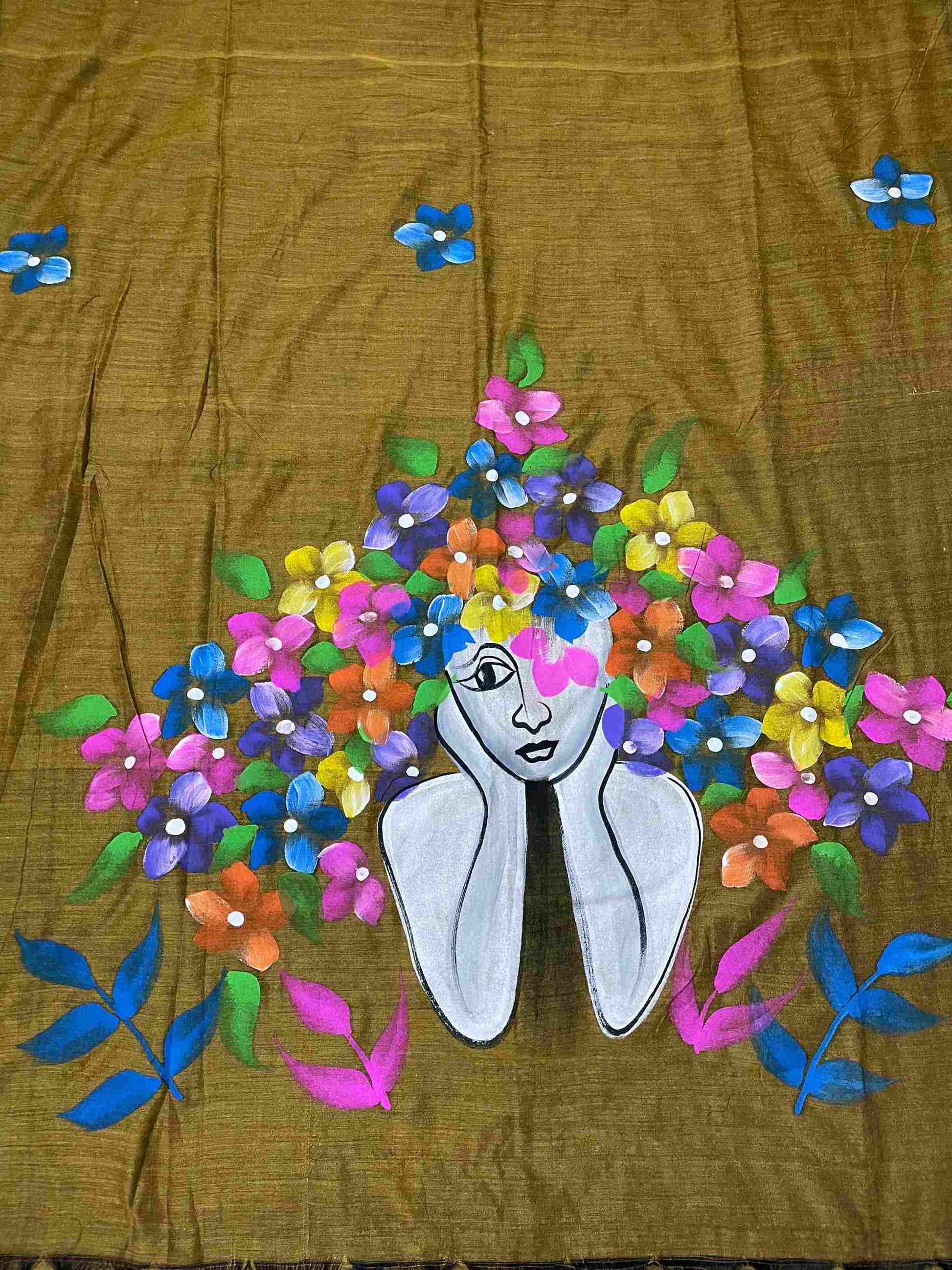 Detailed hand painted doll design on mustard gold mul cotton saree