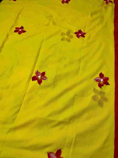 Close-up of hand-painted doll design on Yellow mul mul cotton saree