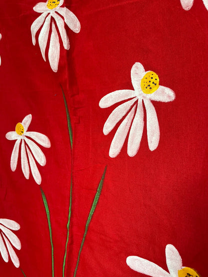 Close-up of hand-painted Shapla design on Red mul mul cotton saree