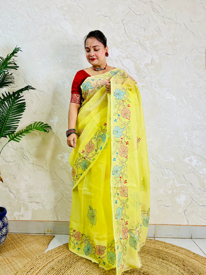 Front standing view of pastel yellow semi Tussar saree with hibiscus vine embroidery