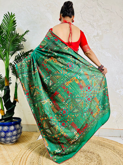 Back standing view of emerald green Lambani saree, pallu draped over shoulder