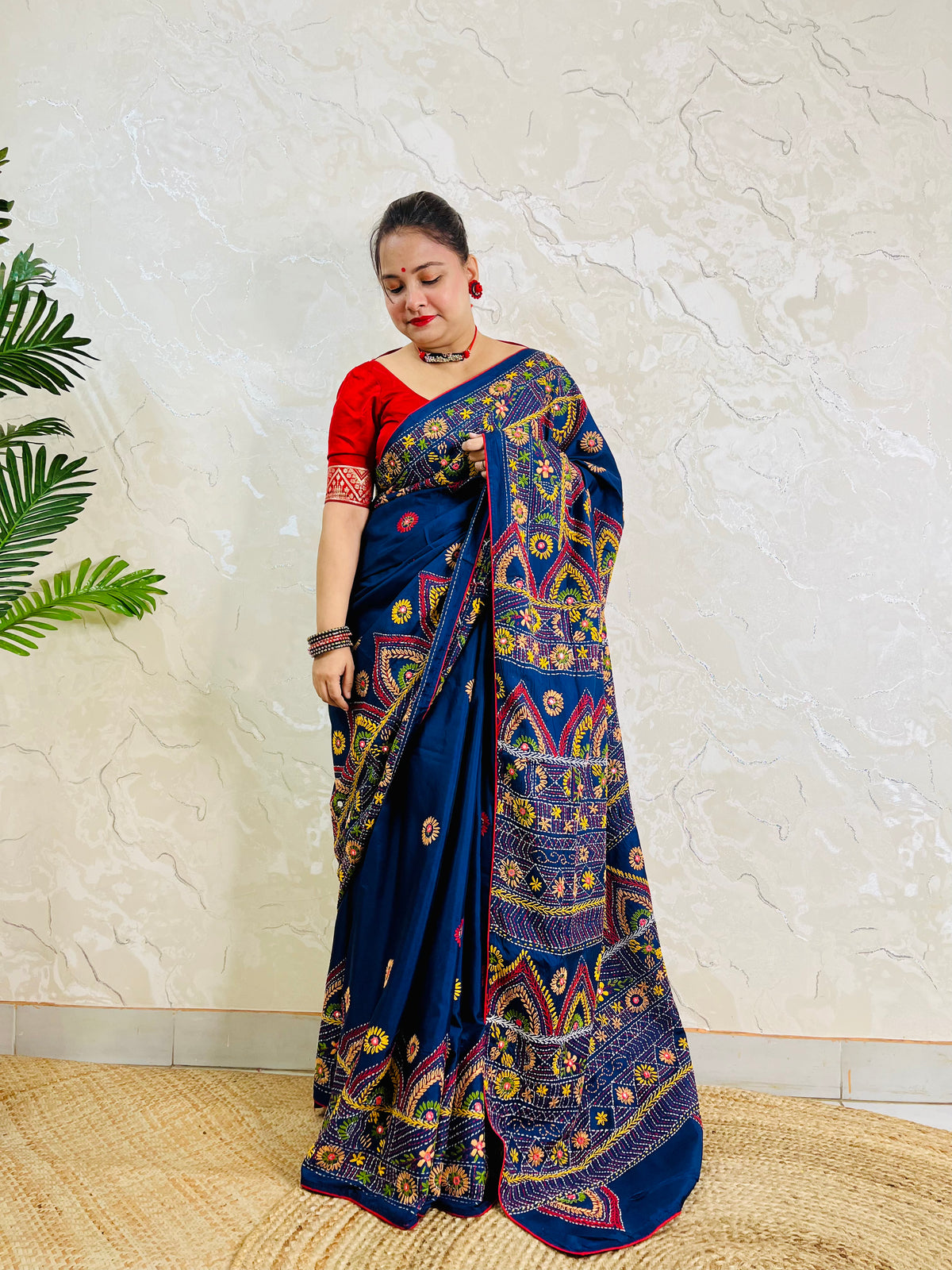 Deep indigo Lambani mirror work saree, standing draped pallu view
