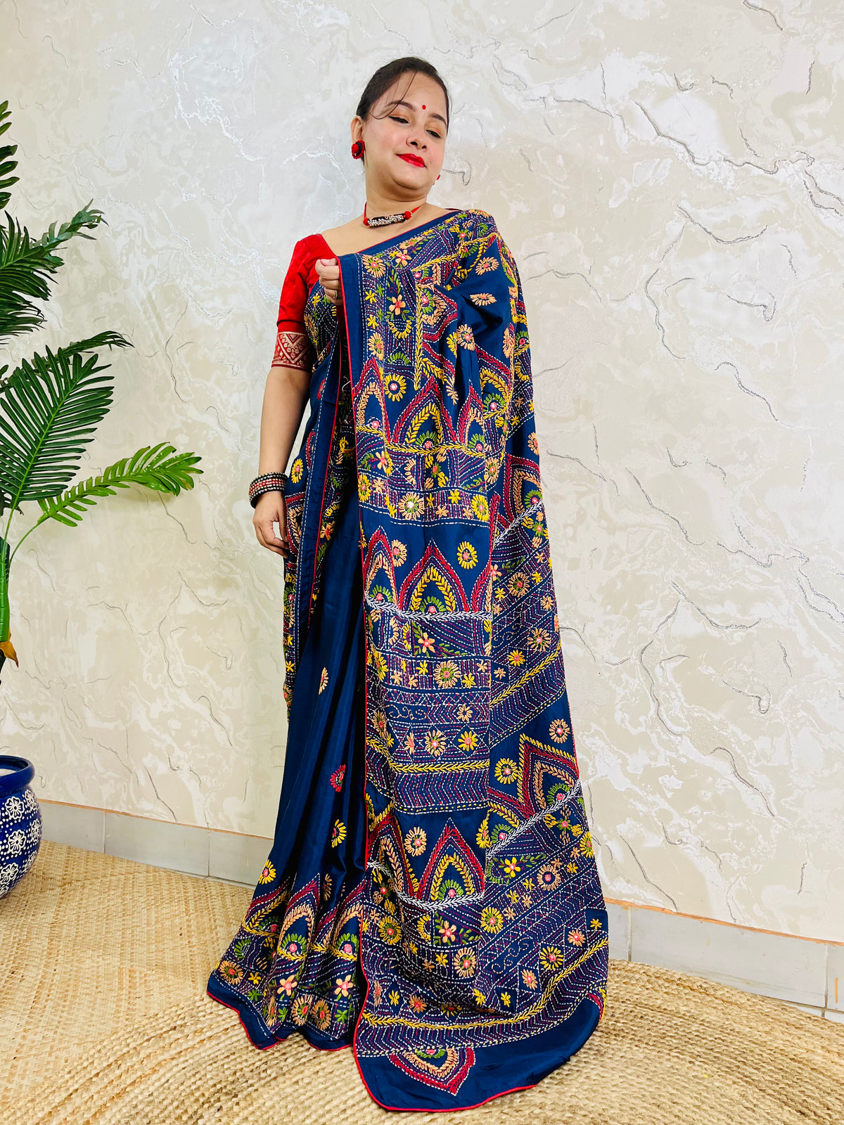 Deep indigo Lambani mirror work saree, standing draped pallu view