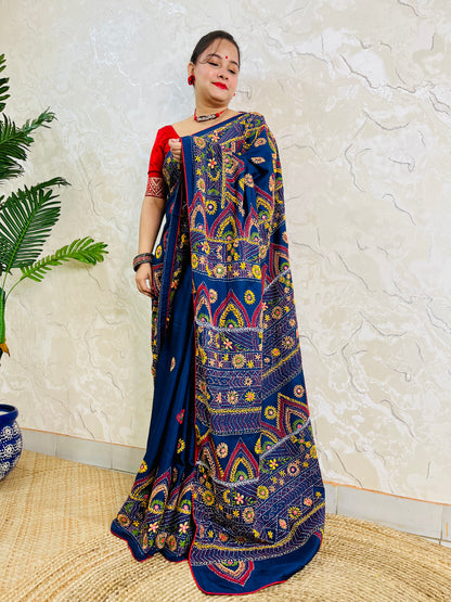 Deep indigo Lambani mirror work saree, standing draped pallu view